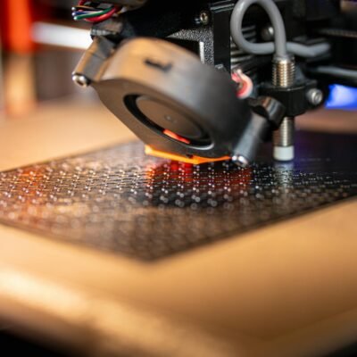 Detailed view of a 3D printer in action, showcasing cutting-edge manufacturing technology.